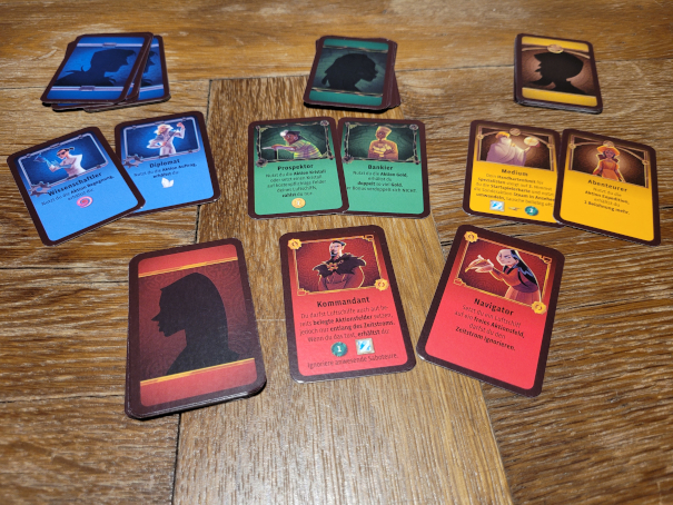 Die Spezialistenkarten in den vier Spielerfarben.