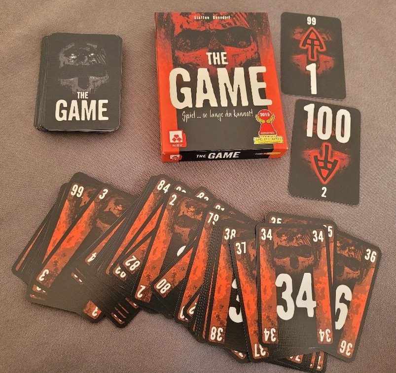 Die Schachtel und Karten von "The Game".