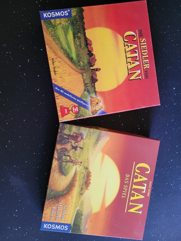 Das alte und neue Cover von "Catan", rechts von Michael Menzel