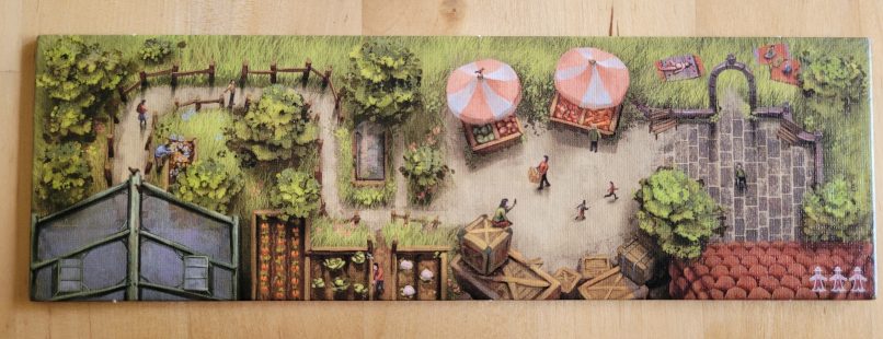 Ein Spielplanteil zeigt Gewächshäuser, Gemüse in Kisten und Betten, Schirme, Pfade und Gewächshäuser.