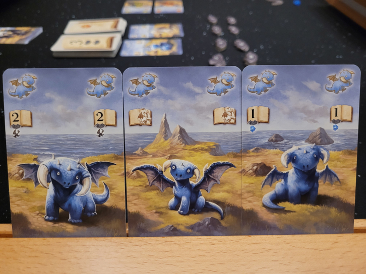 Drei Karten mit drei blauen Drachen aus "Drachenhüter".