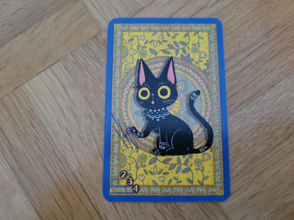 Eine Karte, die eine schwarze Katze zeigt.