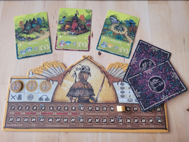 Ein Spielertableau und Karten aus "Kleine Völker, großer Garten".