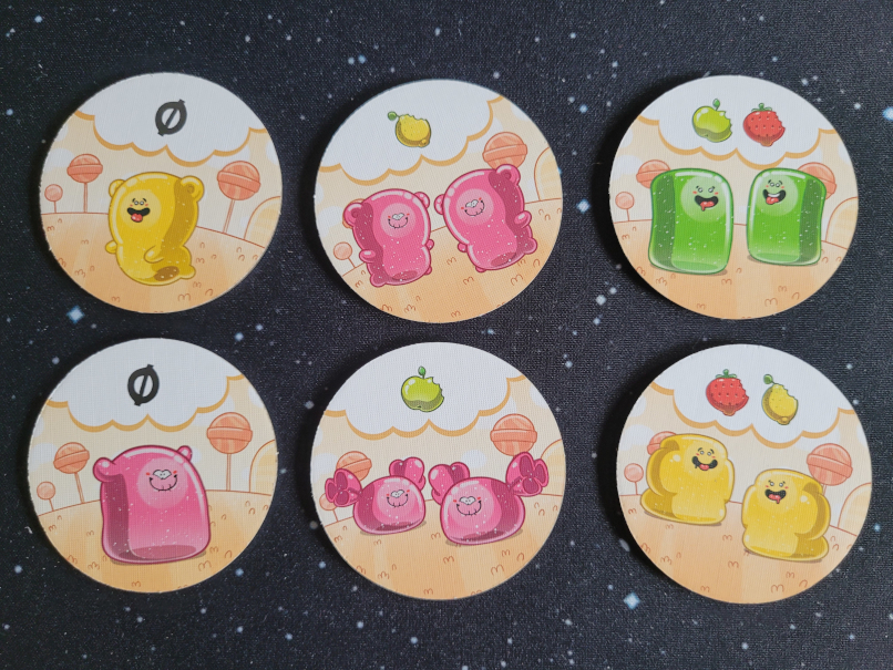 Sechs Plättchen mit "Gumminis" und Symbolen.
