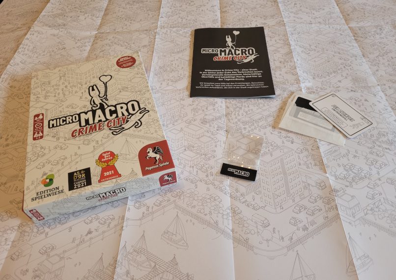 Das Spielmaterial "Micro Macro Crime City".