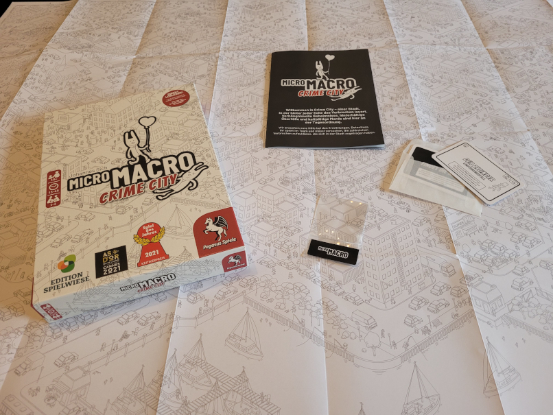 Das Spielmaterial "Micro Macro Crime City".