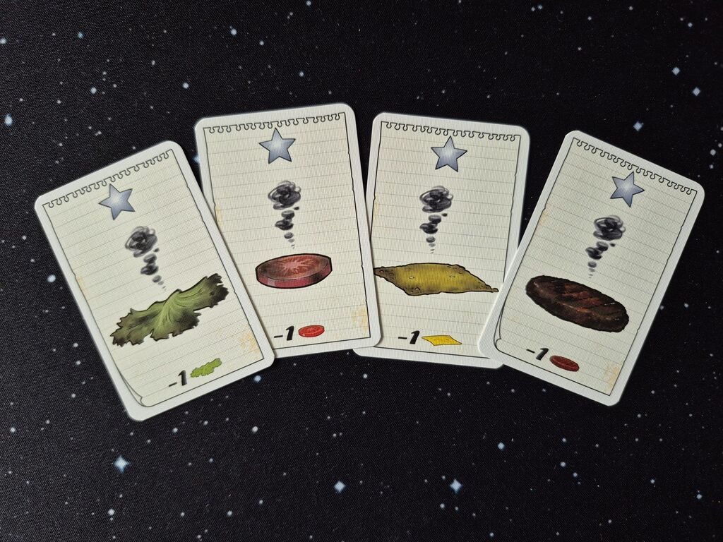 Vier Karten mit verbrannten Zutaten aus "Burger Slam".