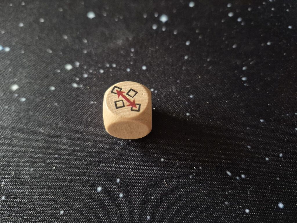 Ein Würfel zeigt ein Symbol.