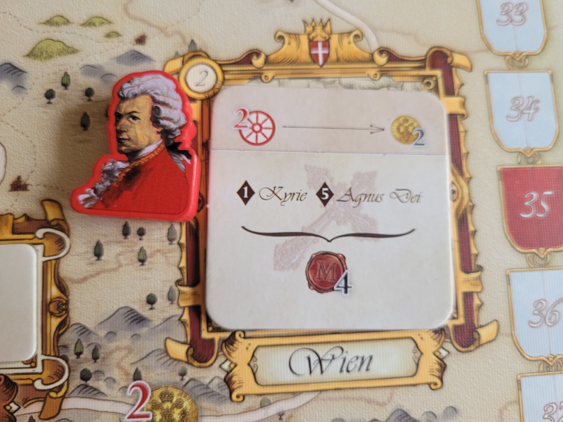 Ein Marker liegt neben einem Plättchen auf der Stadt Wien auf dem Spielplan.