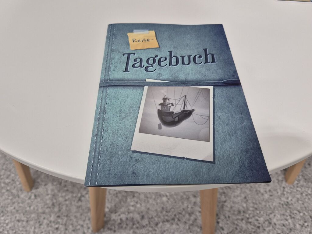 Ein Heft mit Text und einem Foto von einem Luftschiff.