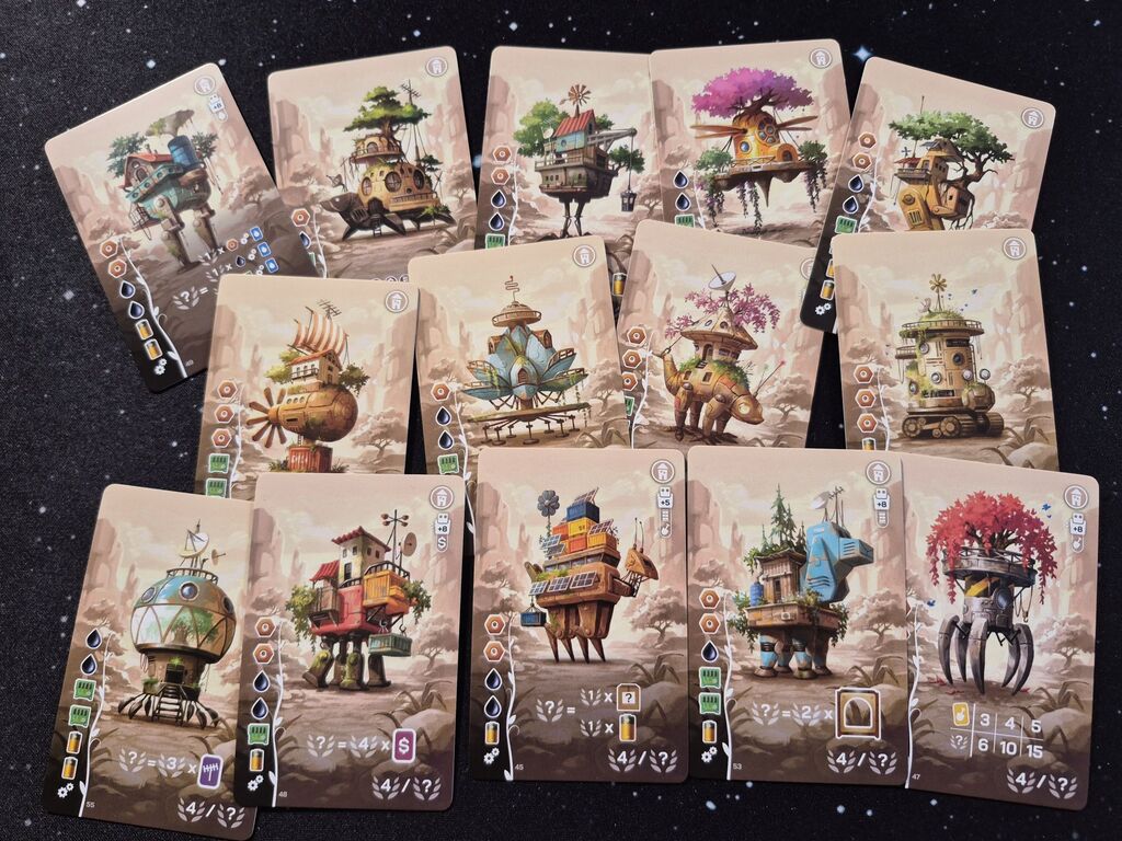 Karten mit Illustrationen von Robotern in Form kurioser Häuser.