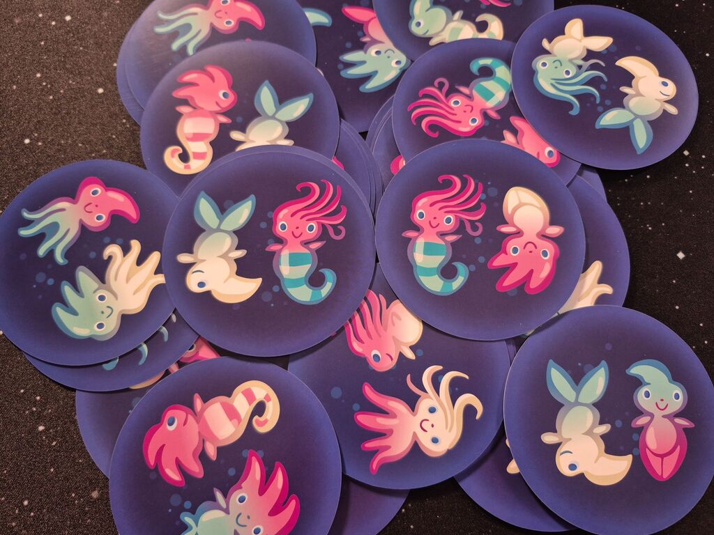 Ein haufen runder Plättchen mit je zwei Wasserwichteln.