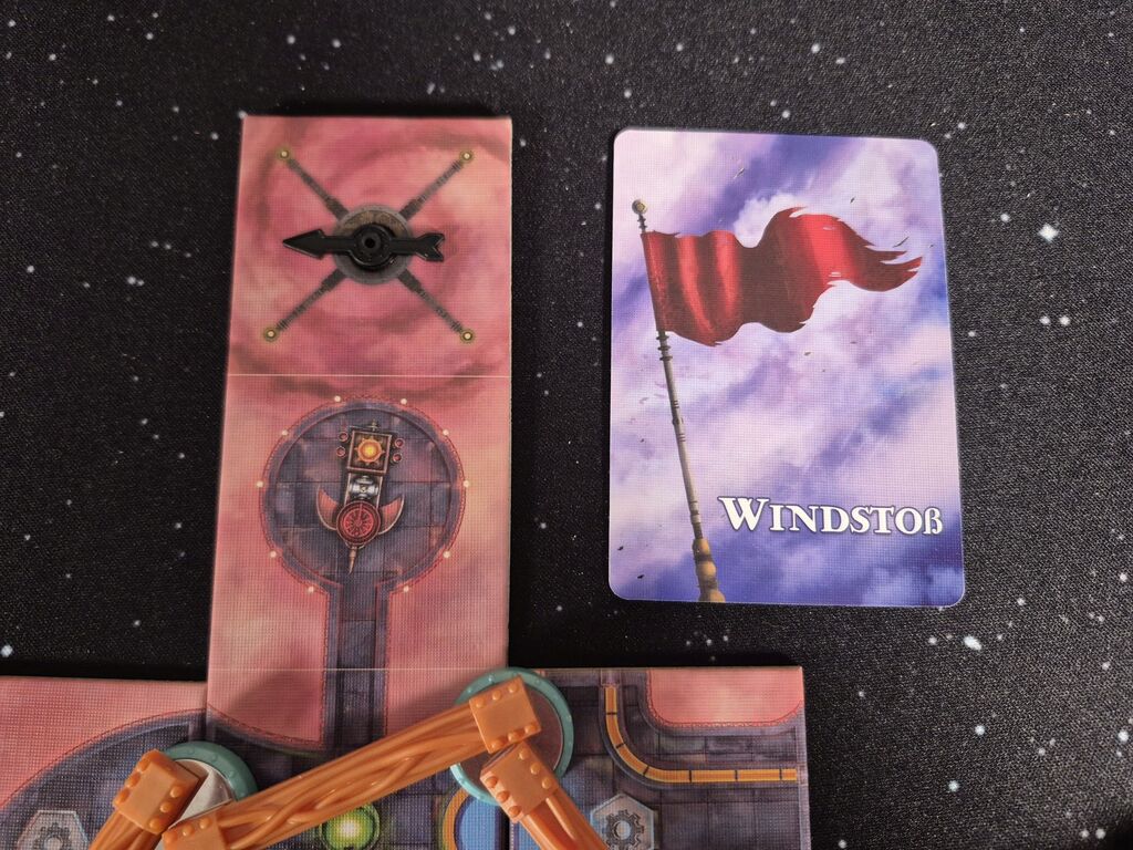 Eine Karte neben Spielplanteil.