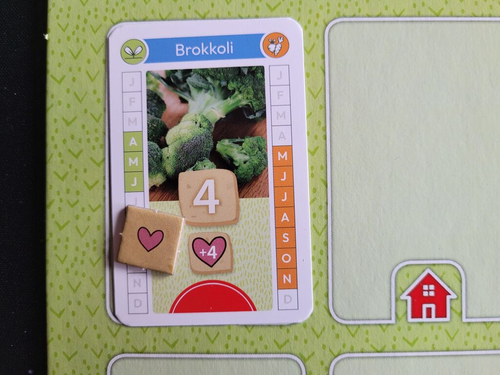 Ein Marker mit einem Herz liegt auf einer Karte.