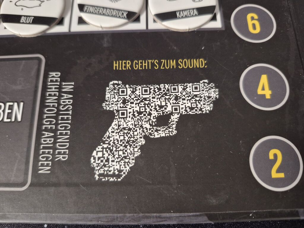 Ein QR-Code auf dem Spielplan von "Safehouse".