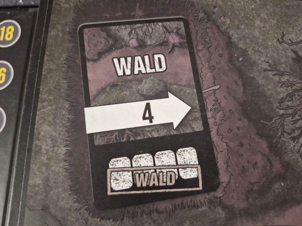 Spielplanausschnitt mit einer aufgedruckten Karte mit Text und Symbolen aus "Safehouse".