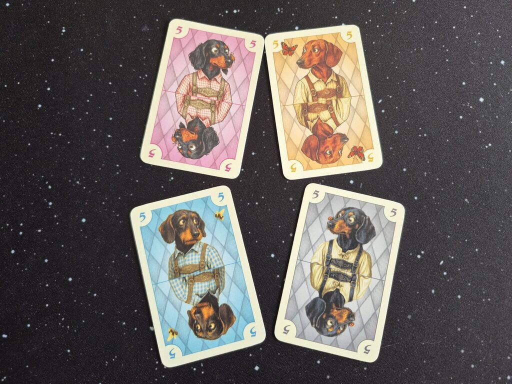 Vier Karten mit lustigen Dackeln.