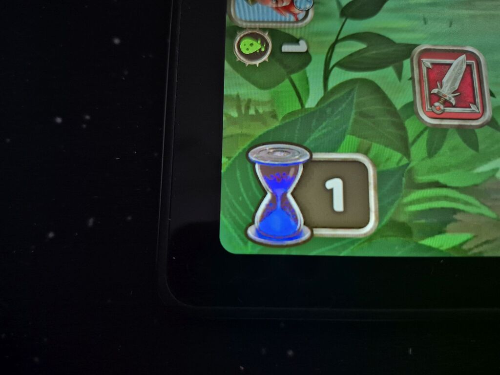 Tabletausschnitt mit Sanduhr und Zahl.