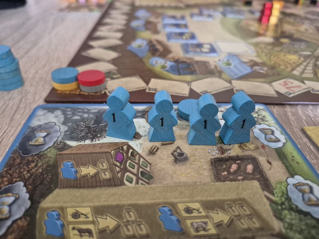 Spielfiguren auf Spielertableau.