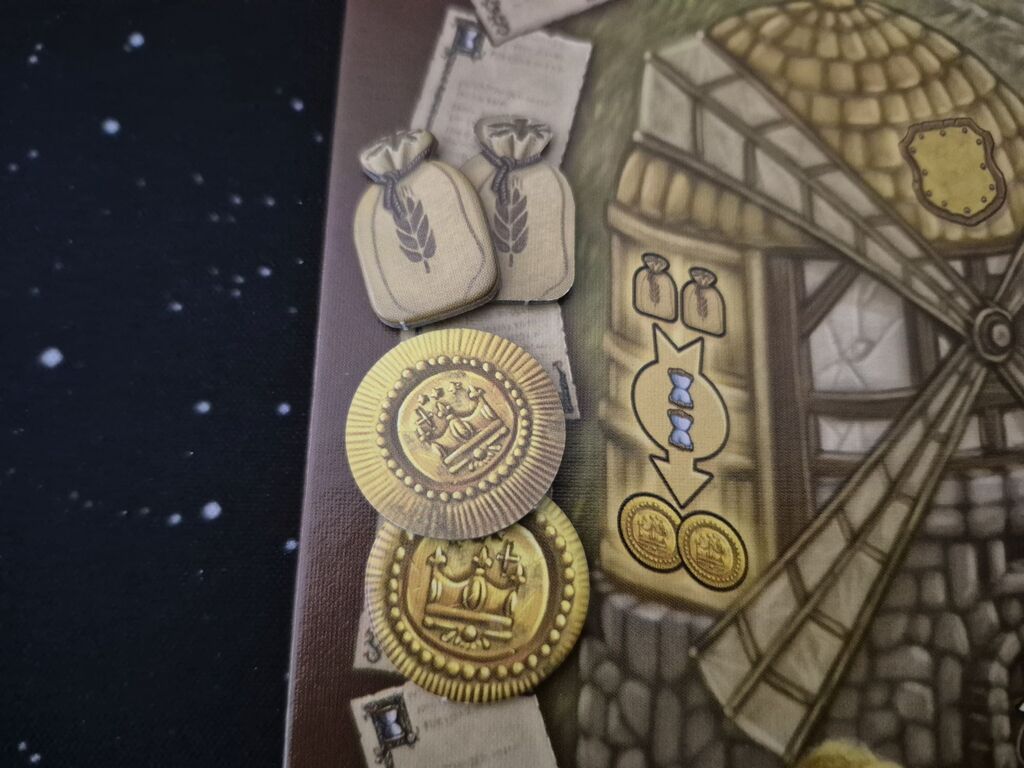 Spielplanausschnitt mit Plättchen und Symbolen.