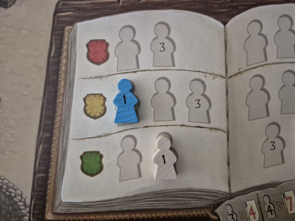Meeple auf Spielplanausschnitt.