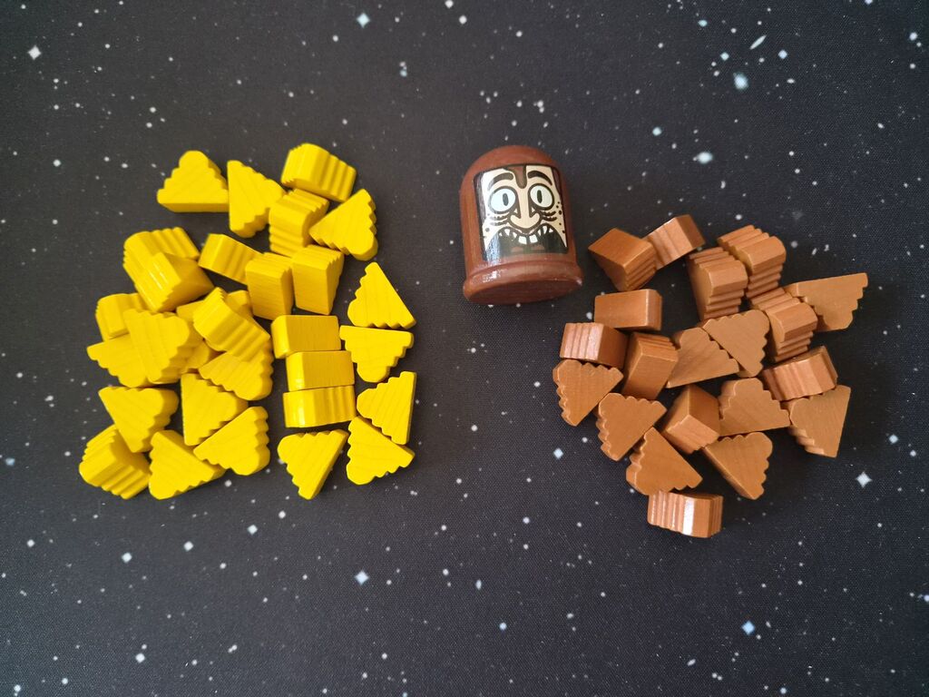 Zwei Haufen Holzmarker, eine Spielfigur aus "Tokyo Poo Divers".
