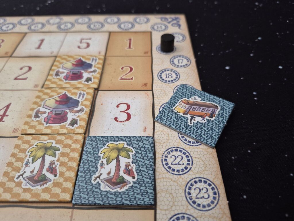 Plättchen auf Spielplan.