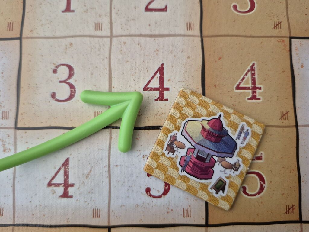 Plättchen auf Spielplanausschnitt.