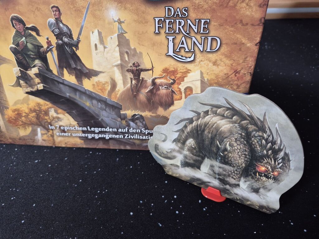 Cover-Ausschnitt und große Monster-Spielfigur.