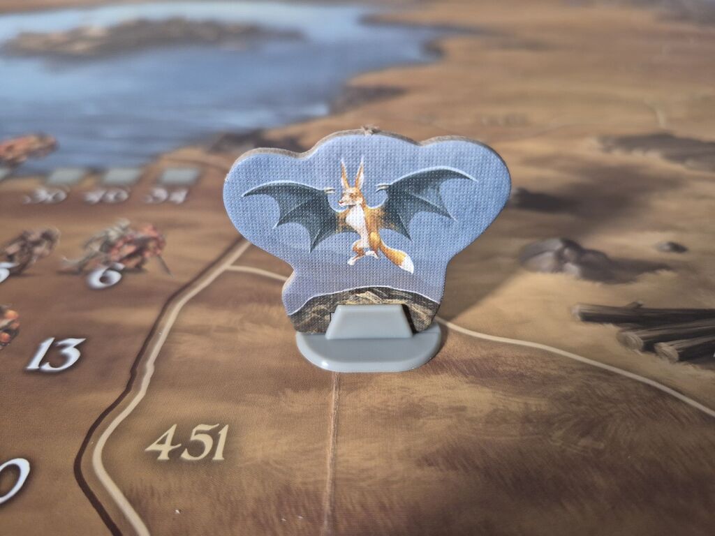 Spielfigur auf Spielplan.