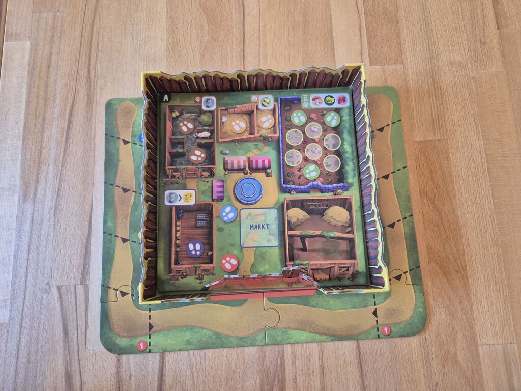 Spielplan von "Monsterhunger" mit eingesteckten Zaunelementen.